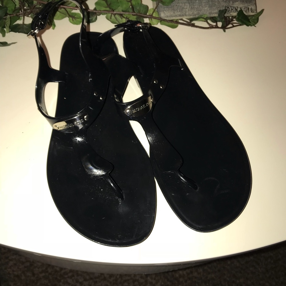 Black Michael Kors sandals.